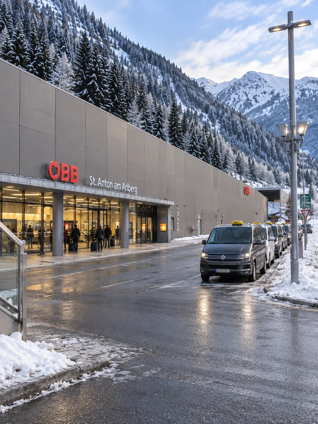 Taxi rank outside St. Anton am Arlberg railway station Taxis waiting at the rank outside St. Anton am Arlberg railway station in winter, with travellers and luggage at the entrance