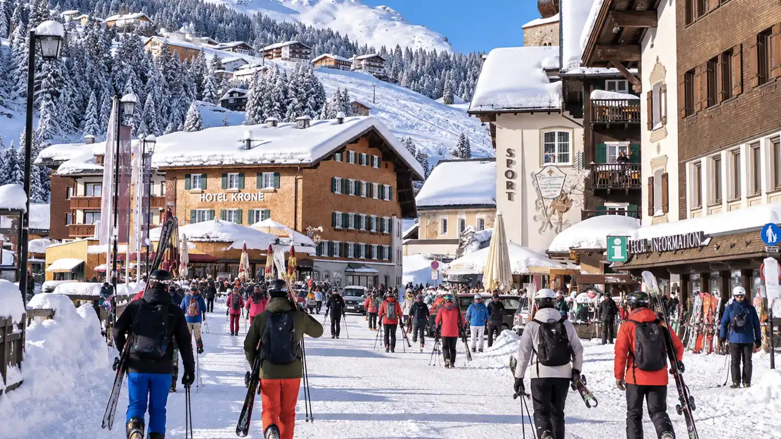 Alpinum Taxi private airport transfer from Zurich to Lech am Arlberg — skiers in the centre of Lech in winter
